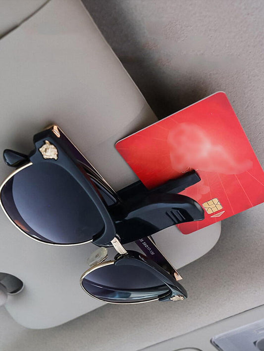 Suport pentru ochelari, prindere la parasolar